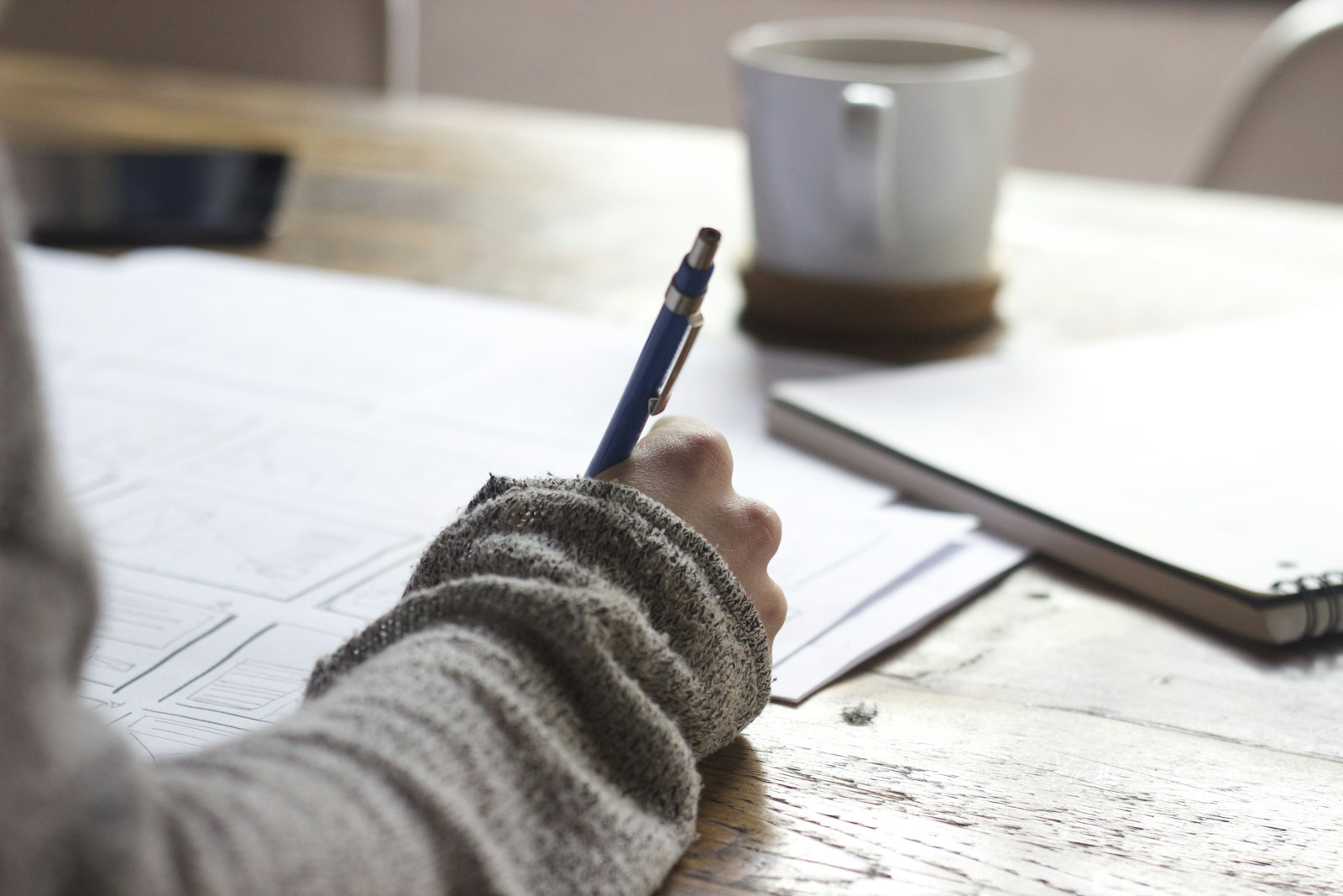 Storyboard pages and creative direction notes spread across a desk